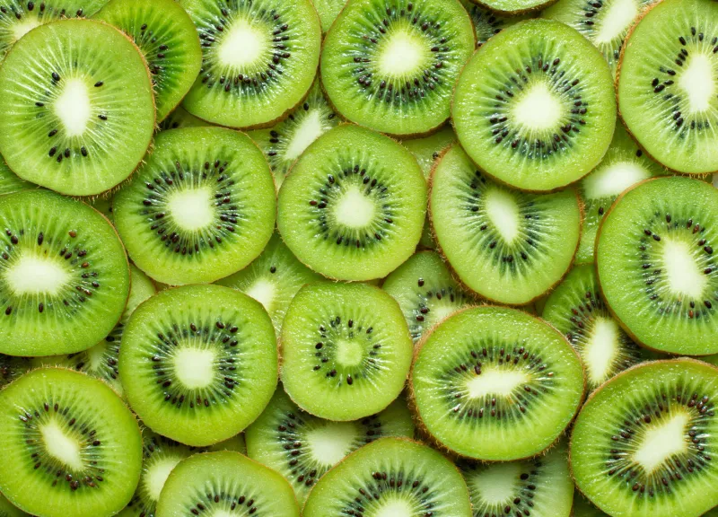 top view of sliced kiwi as background