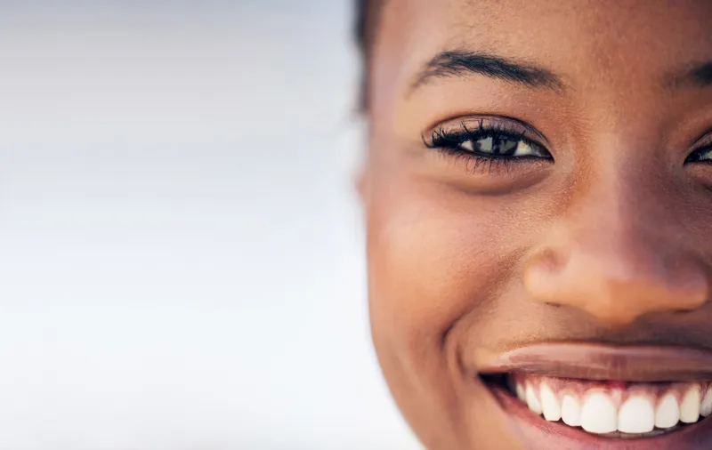 closeup shot of a beautiful young woman standing outside