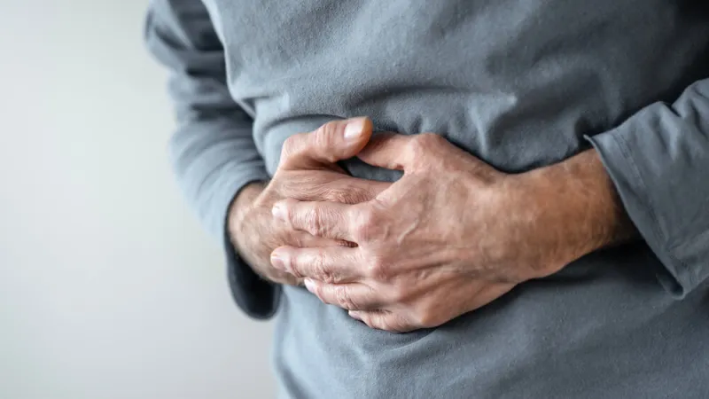 senior man with stomach pain