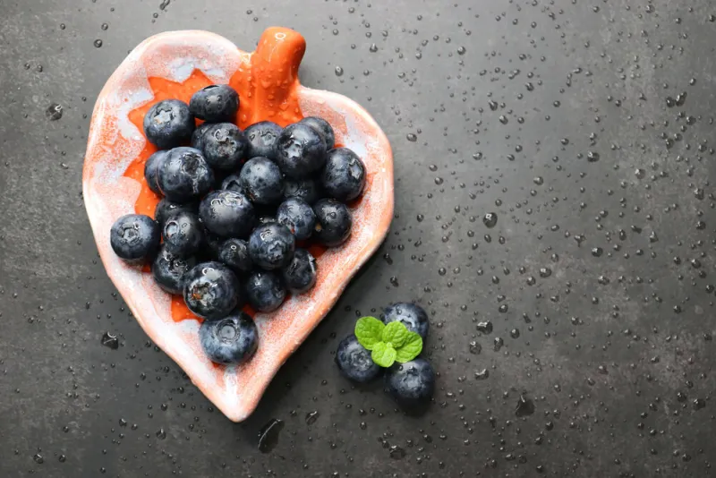 fresh blueberries with mint leaves the fruits are actual berrie