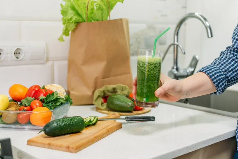 benefits of cucumber juice green smoothies cooking for detox and weight loss glass of fresh cucumber juice on home kitchen table