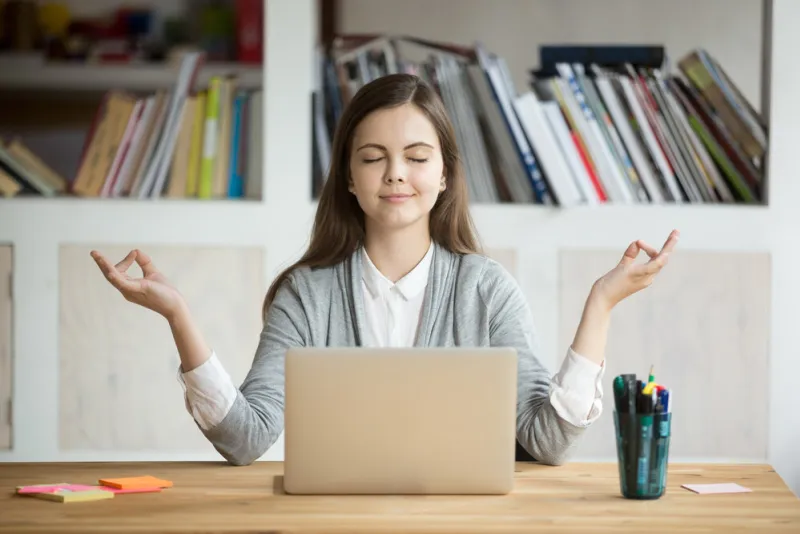 calm woman relaxing meditating with laptop, no stress free relief at work concept, mindful peaceful young businesswoman or student practicing breathing yoga exercises at workplace, office meditation