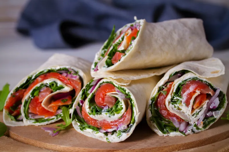 smoked salmon, cream cheese, spinach and arugula wraps fish burritos horizontal