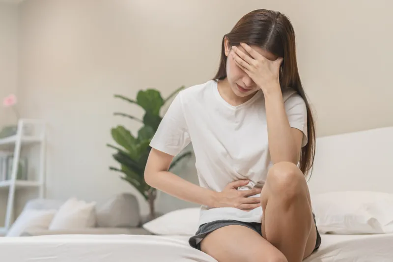 flatulence ulcer, asian young woman, girl hands in belly, stomachache from food poisoning, abdominal pain and digestive problem, gastritis or diarrhoea abdomen inflammation, menstrual period people
