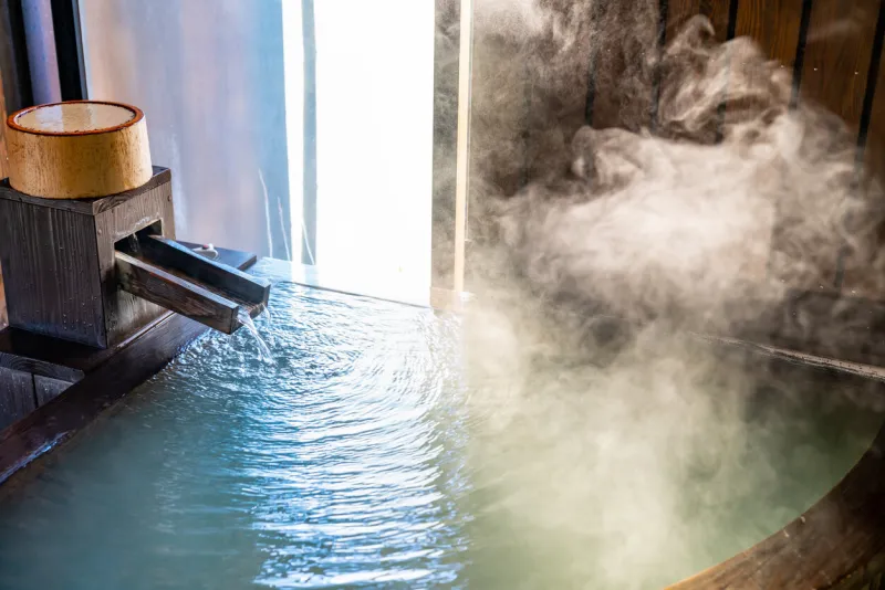 photo of a natural hot spring bath in a guest room with a hot spring