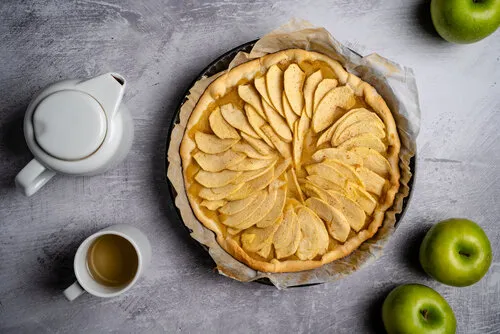 flat,lay,shot,of,french,apple,tart,with,tea,cup