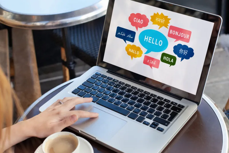 learn foreign language, different languages on screen, english, french, german, arabic, chinese, say hello bonjour ciao hola