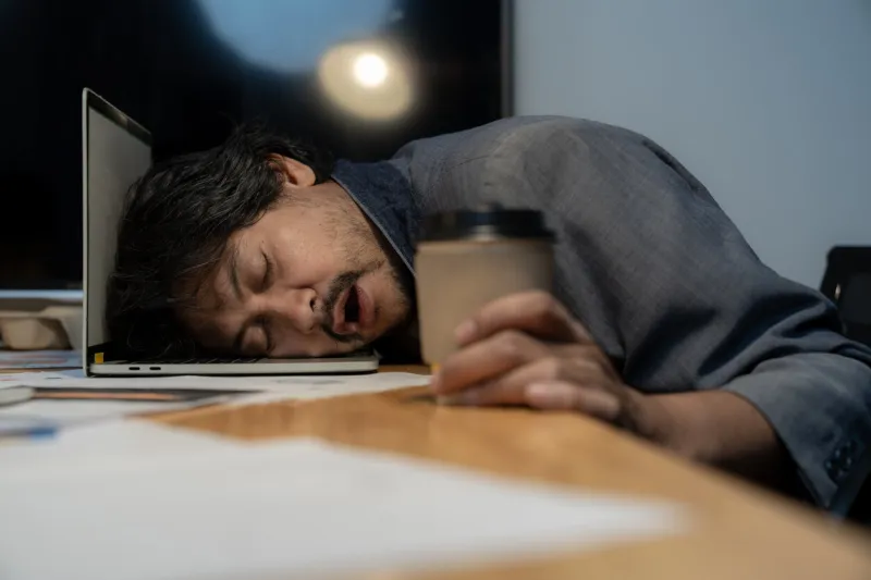 businessman sleeping at desk, work hard late