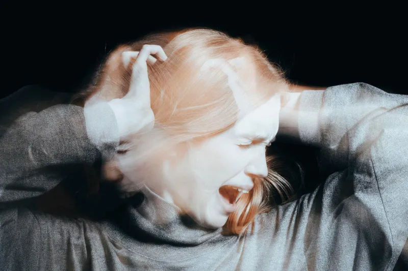 young woman screaming because of delusions and hallucinations