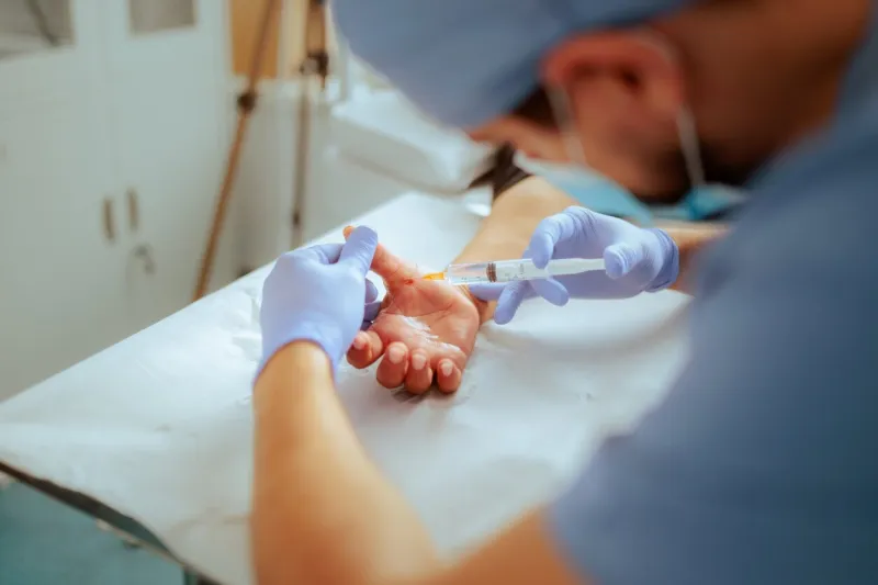 anesthesiologist using sedation for surgical procedure preparation