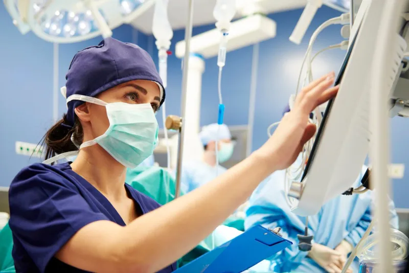 nurse working with technology in operating room