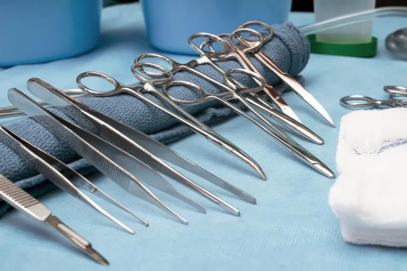 surgical supplies and instruments on a back table of an operating room