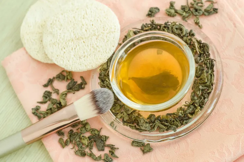 homemade green tea face toner diy cosmetics recipe natural beauty treatment top view, copy space