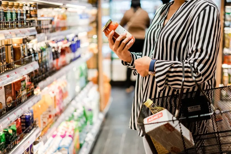 bangkok, thailand - august 5, 2019  woman chooses products in the supermarket, ready-made food, shopping