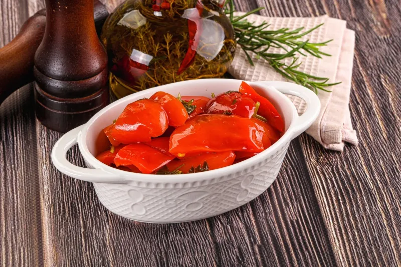 homemade marinated red bell pepper in the bowl