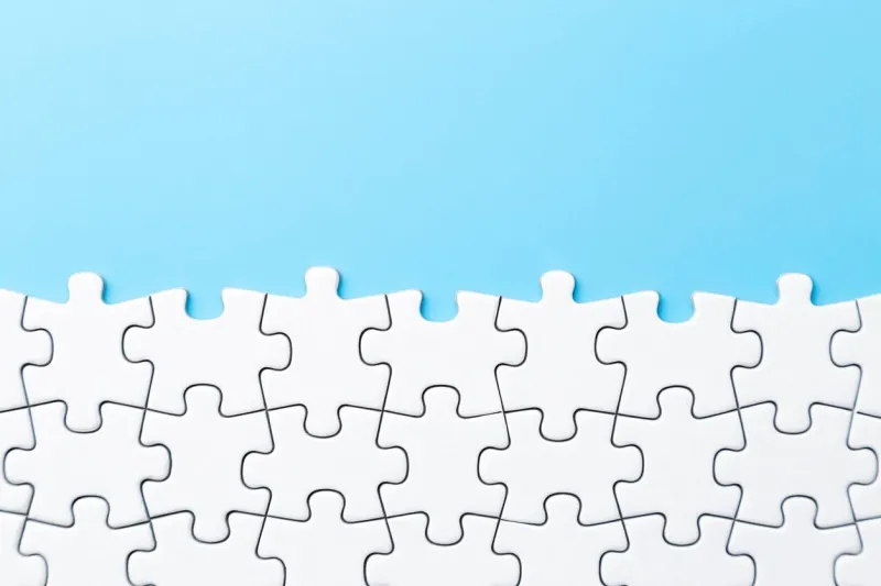 plain jigsaw puzzle on a blue background
