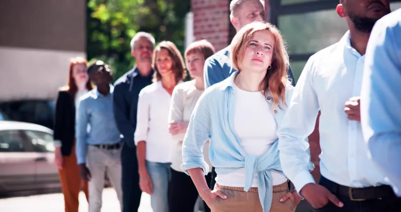 queue outdoors business people waiting in line