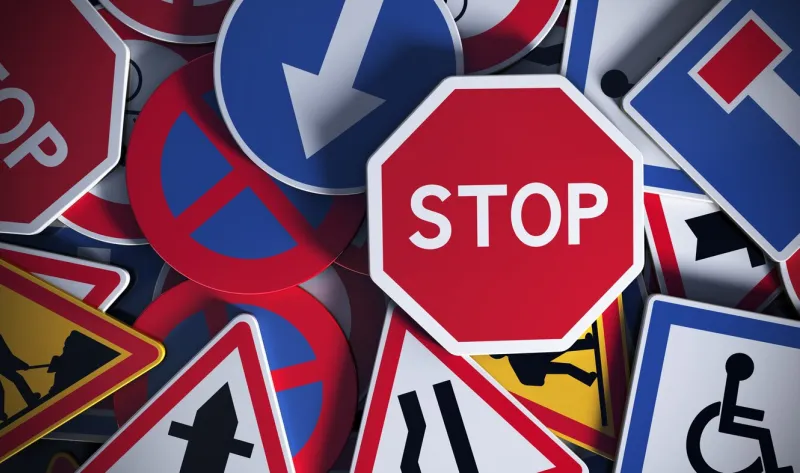front view of numerous french traffic road signs concept image for background