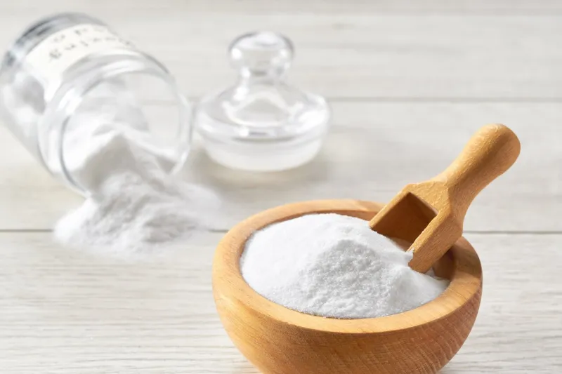 sodium bicarbonate on a white wooden table, close-up