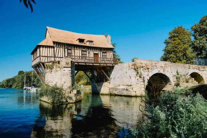 the old mill on the seine river at vernon, normandy, france