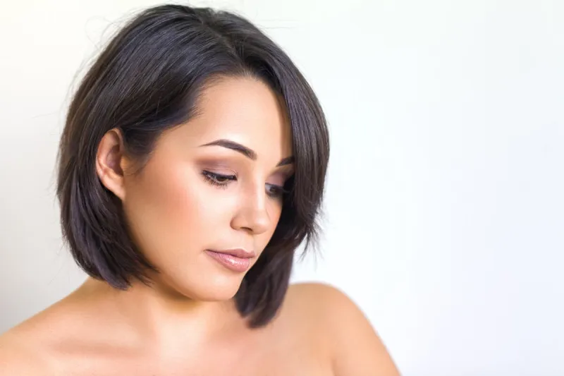 beautiful young woman portrait in front of white background wall beauty shot of lady with perfect face skin