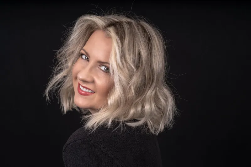 woman with platinum blunt shoulder length bob hairstyle