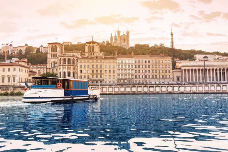 cruise ship on a saone river in lyon, france tourism and transportation concept