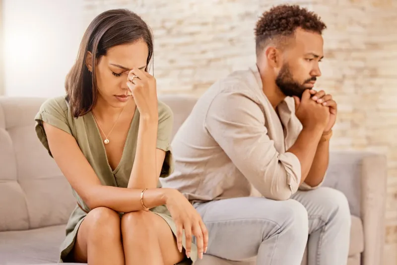 fight, divorce and depression with couple on sofa for conflict, therapy and mental health or marriage counseling sad, anxiety and stress with man and woman in living room for fail, crisis and angry