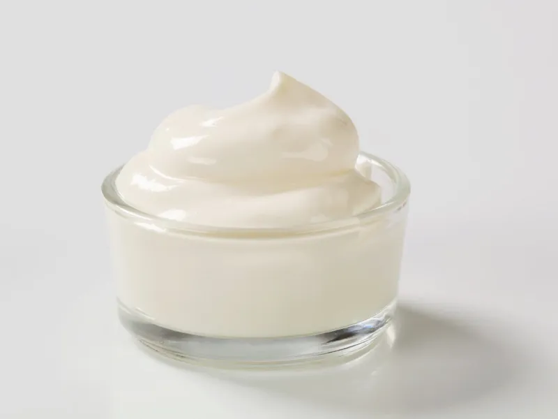 swirl of smooth white cream in a small glass bowl