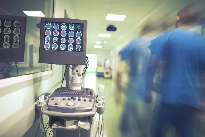 male doctor hurrying in the hospital hallway to the emergency patient