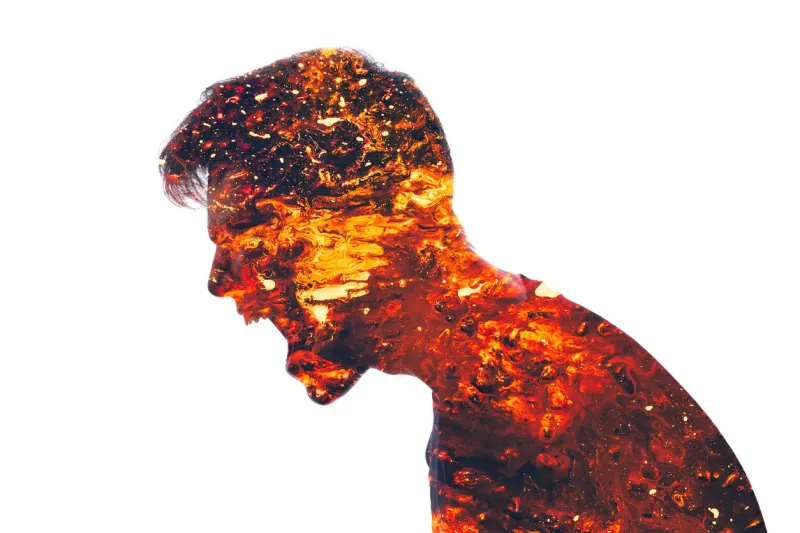 mad scream angry man conflict person aggression neurosis double exposure of furious male silhouette coated in red hot lava isolated on white background