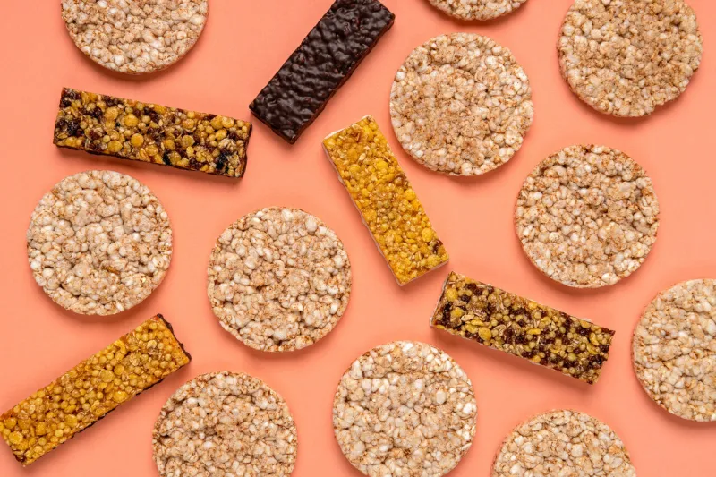 top view of different kinds of fitness bars, crispbreads on the