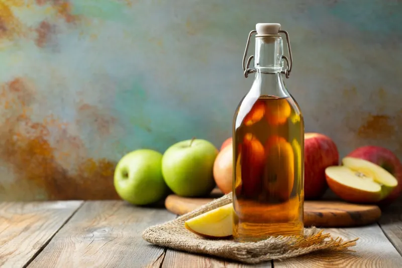 apple vinegar bottle of apple organic vinegar or cider on wooden background healthy organic food with copy space