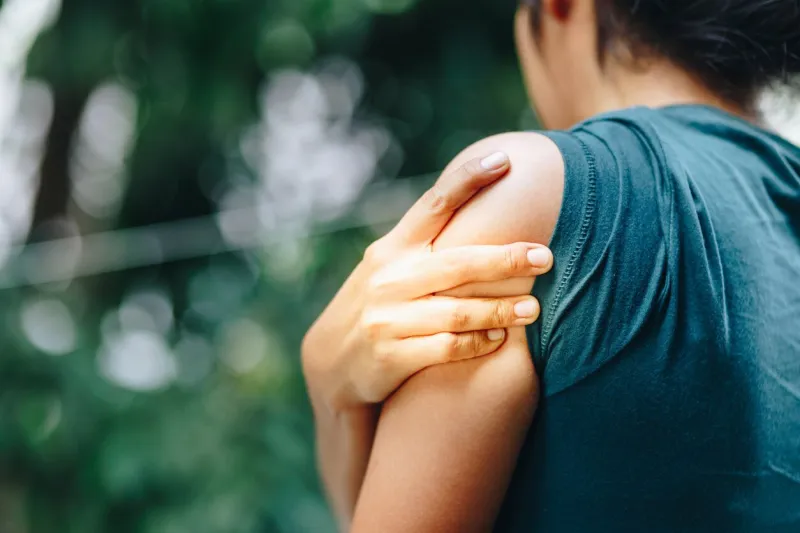 woman with pain in shoulder and upper arm ,ache in human body , office syndrome , health care concept