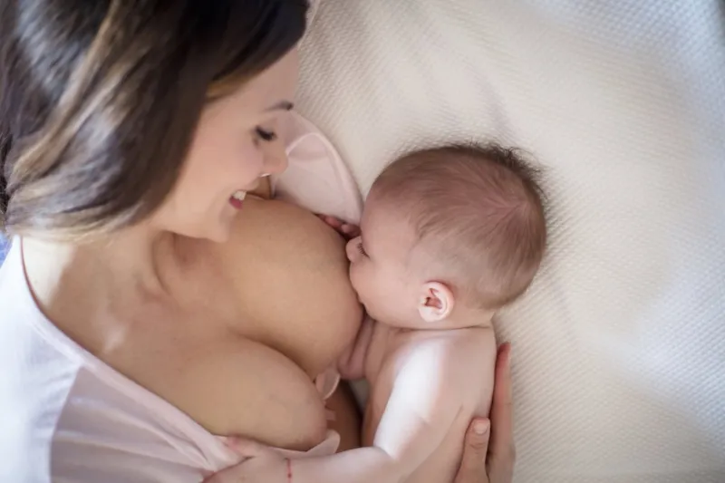 it's a special time for them to bond mother feeding her baby close up