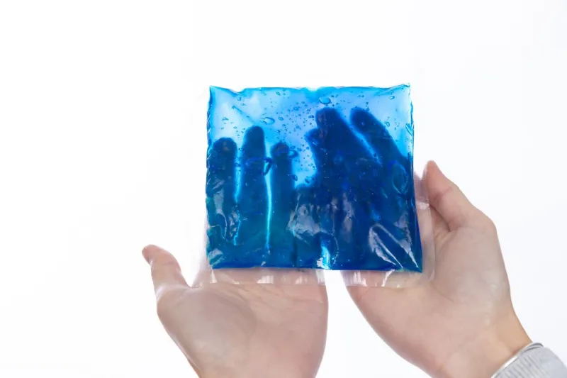 blue color cold gel packet in hand