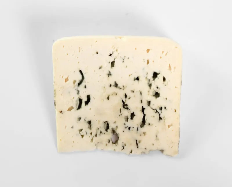 blue cheese isolated on gray background directly above