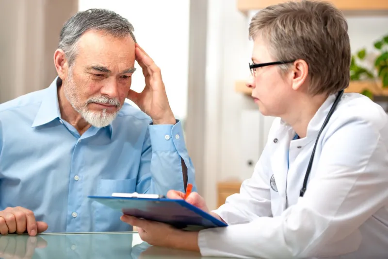 male patient tells the doctor about his health complaintsplease see similar images here