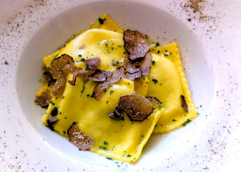 ricotta ravioli with sliced truffle