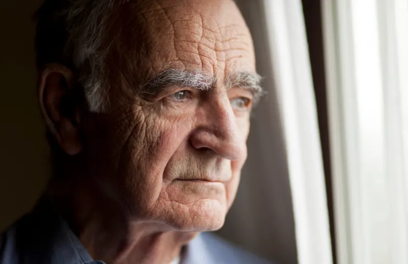 portrait of elderly man lost in thought