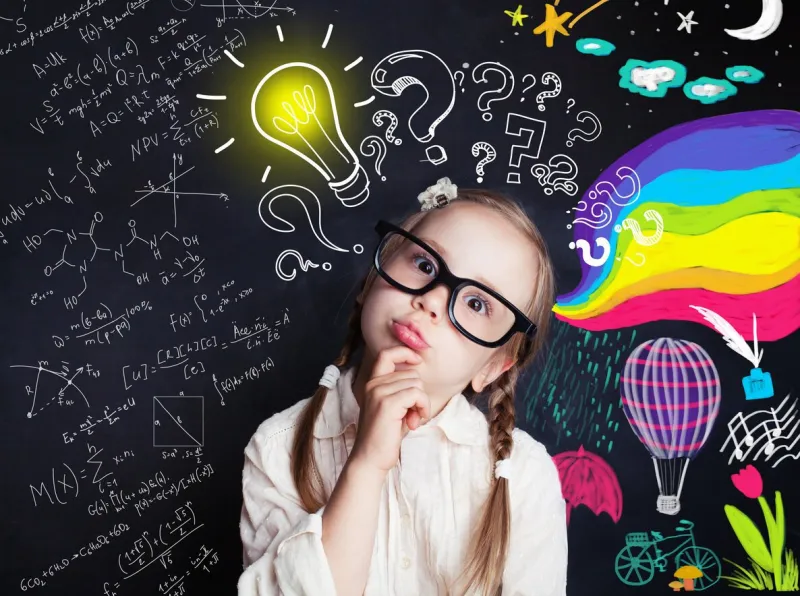 pensive child school student with yellow lightbulb and school and childhood supplies design elements child ideas and development concept
