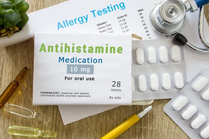 antihistamine medication or allergy drug concept photo on doctor table is pack with word antihistamine medication and pills for treatment of allergy and hypersensitivity