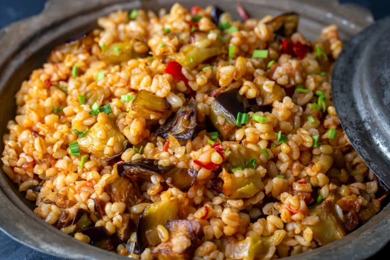 traditional delicious turkish food, bulgur pilaf with eggplant and vegetables (turkish name, patlicanli bulgur pilavi)