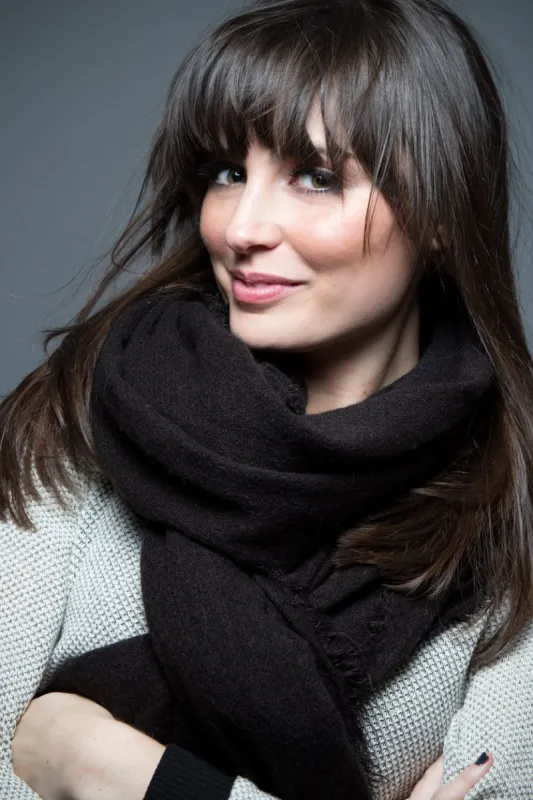 portrait of beautiful brunette model wearing sweater and scarf