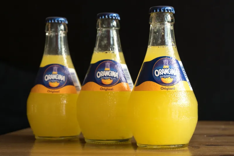 orangina sparkling citrus beverage bottles