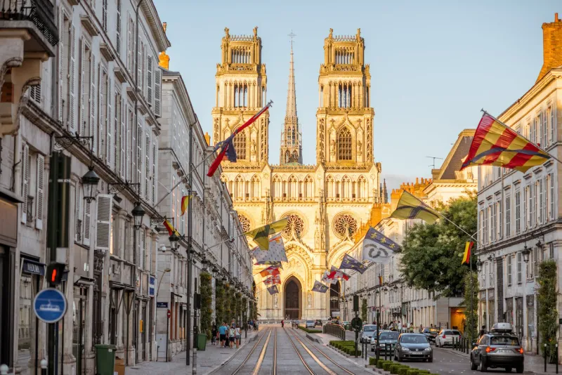 orleans, france - august 01, 2017  view on the central avenue with famous cathedral during the sunset in orleans city in central france
