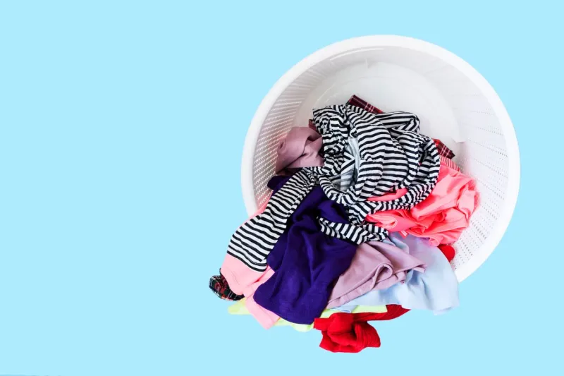 dirty clothes at laundry basket