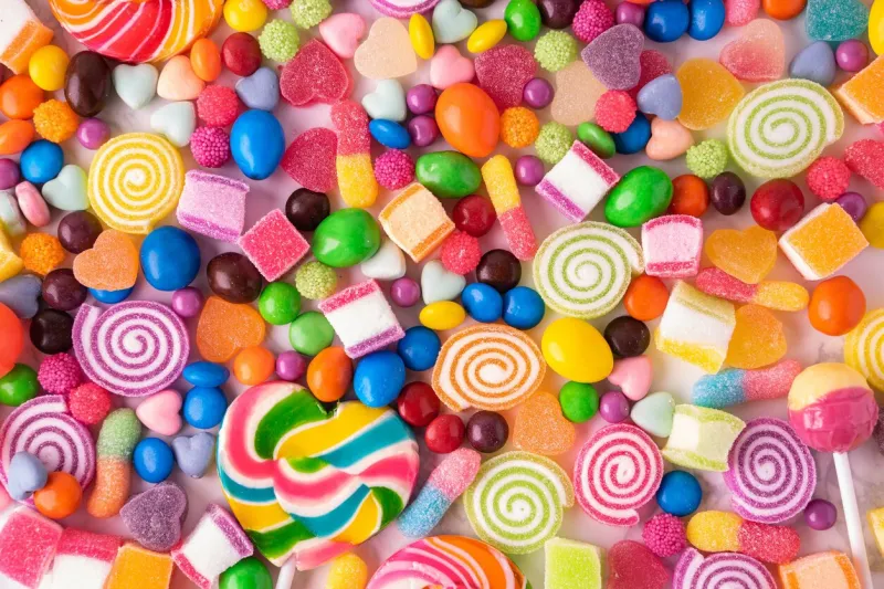 lollipops candies and sweet sugar jelly multicolored, colorful sweets top view and close up background