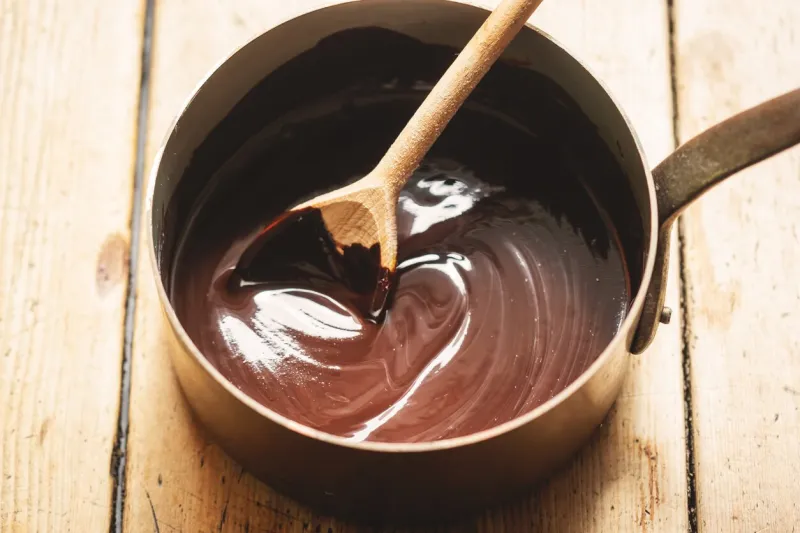 preparing chocolate sauce in pot