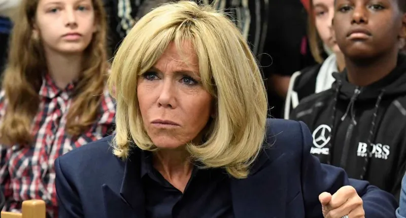 french president's wife brigitte macron gestures during a visit to raise awareness about bullying in a school of clamart, near paris, on november 15, 2018 (photo by bertrand guay   afp)